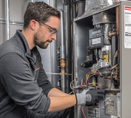 professional technician inspecting home furnace heating system in New Jersey